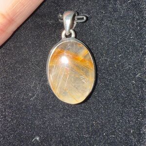 Golden rutile and quartz pendant